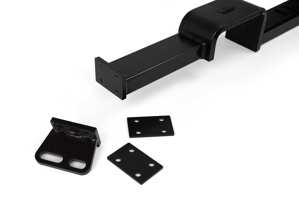 A body hardtop crossmember with Gear Vendors Overdrive Unit removable end-tabs and spacer plates